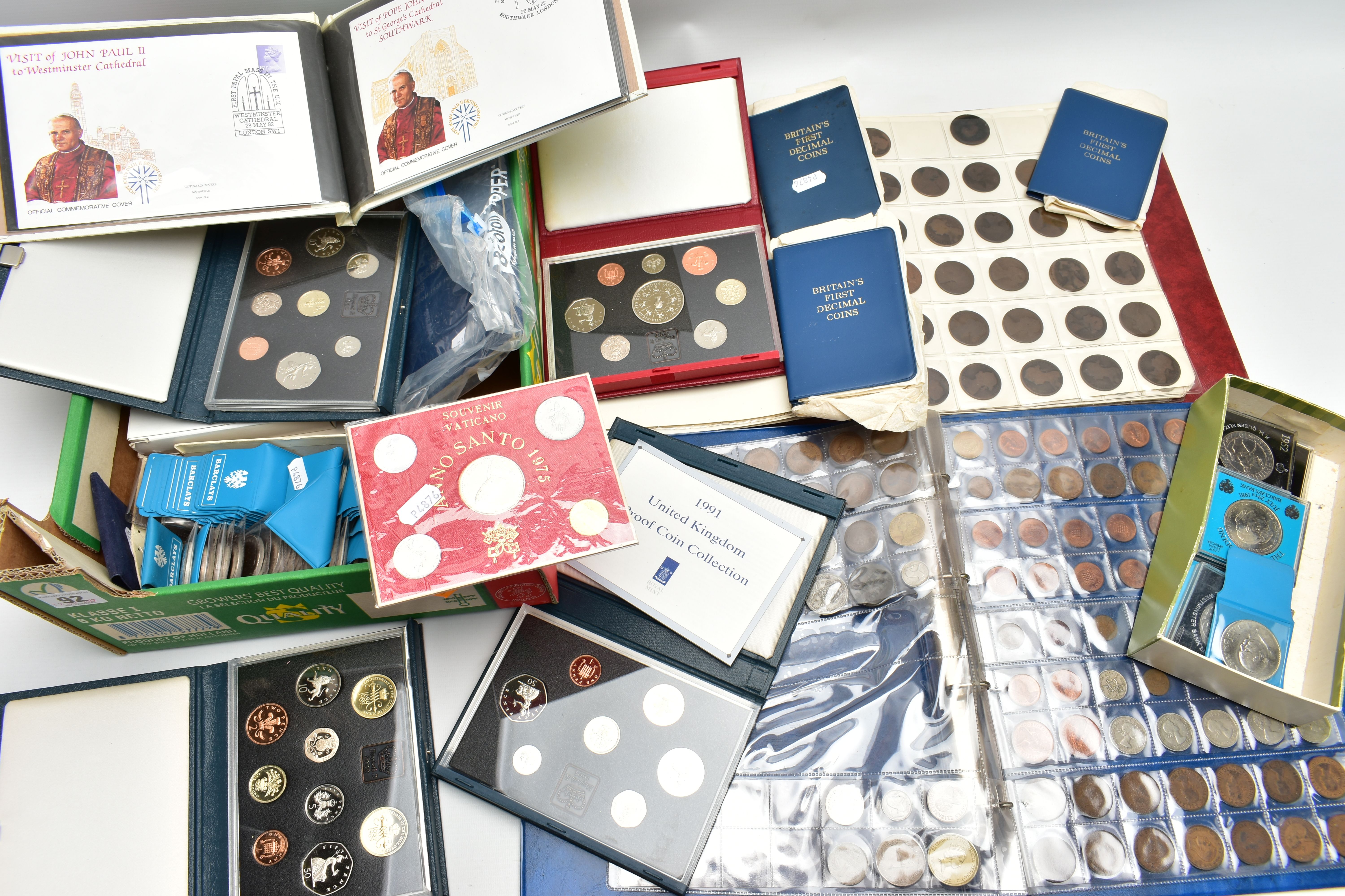 A CARDBOARD BOX OF MAINLY UK COINAGE, to include UK Proof sets of coins 1899,90,91,93,97, BU sets