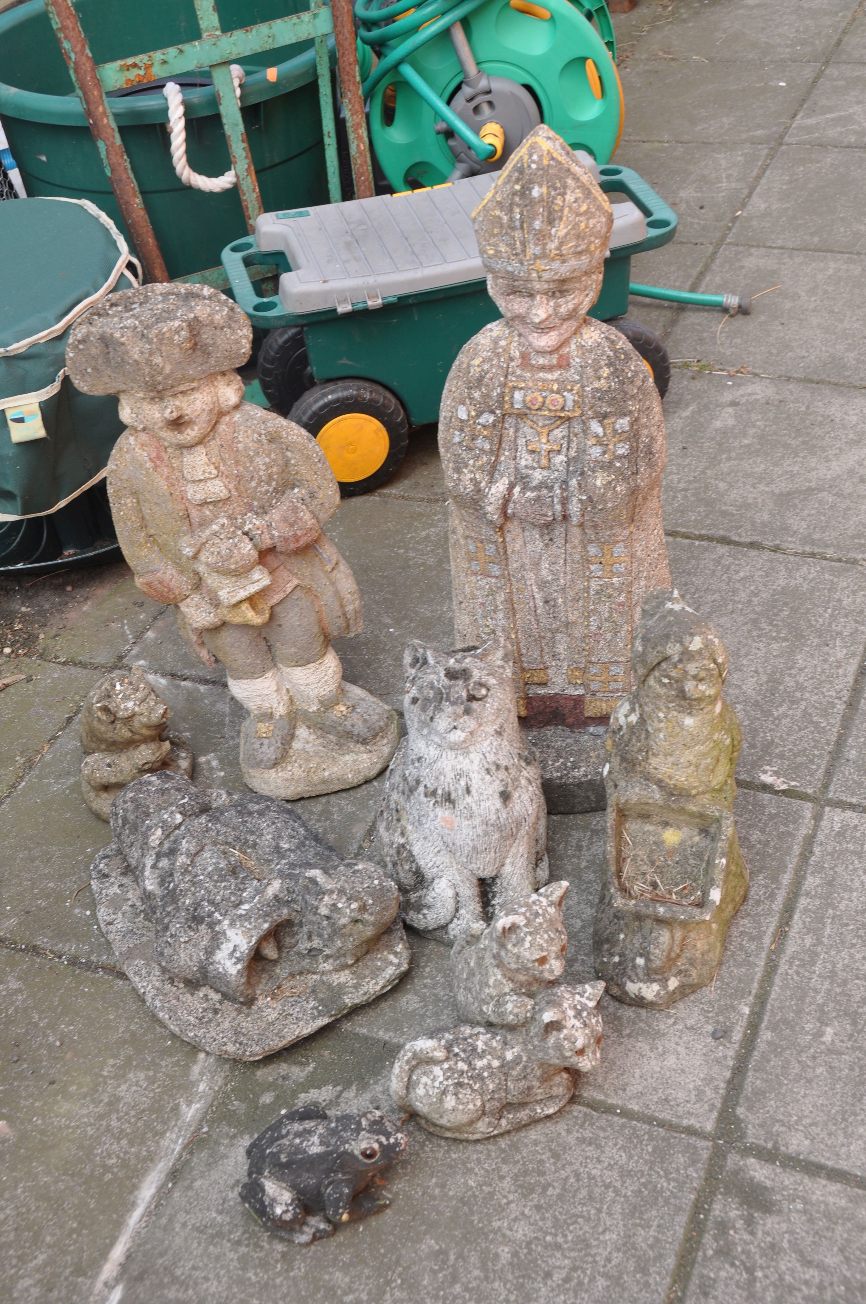 A SELECTION OF EIGHT COMPOSITE GARDEN FIGURES including a Bishop height 65cm, a town crier height