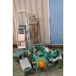 TWO SETS OF ALUMINIUM STEPS, a steel set of ladders, a hose reel, sack truck, step toolbox, and a