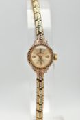A LADIES 'TECHNOS' YELLOW METAL WRISTWATCH, hand wound movement, round champagne dial signed '