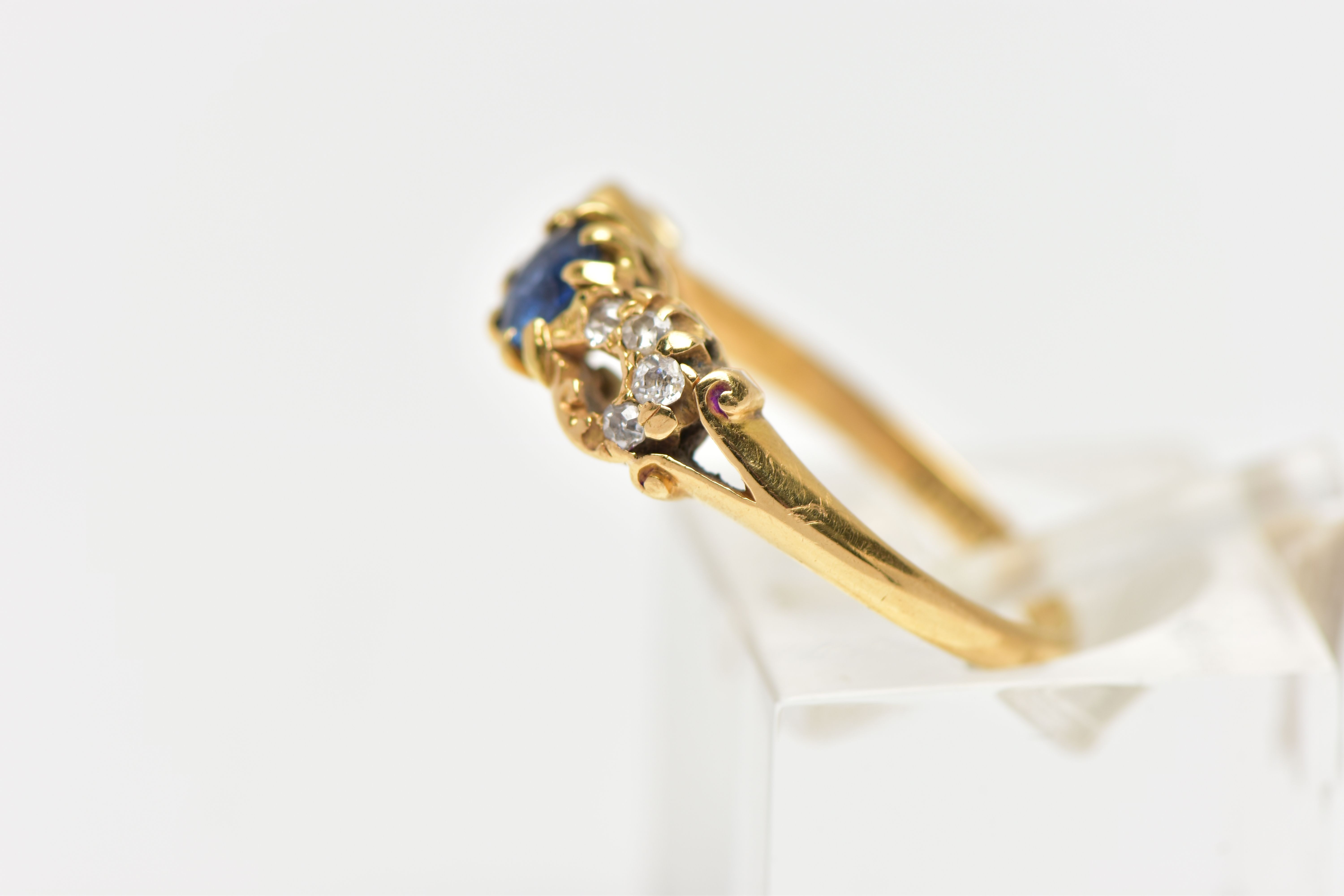 A LATE VICTORIAN 18CT GOLD SAPPHIRE AND DIAMOND DRESS RING, the oval cut sapphire claw set, with old - Image 2 of 4