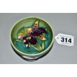 A MOORCROFT POTTERY SMALL FOOTED BOWL, decorated in Orchid pattern on a graduated green ground,