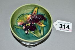 A MOORCROFT POTTERY SMALL FOOTED BOWL, decorated in Orchid pattern on a graduated green ground,