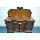 A VICTORIAN SERPENTINE SIDEBOARD, with a raised back, with two cupboard door, enclosing drawers