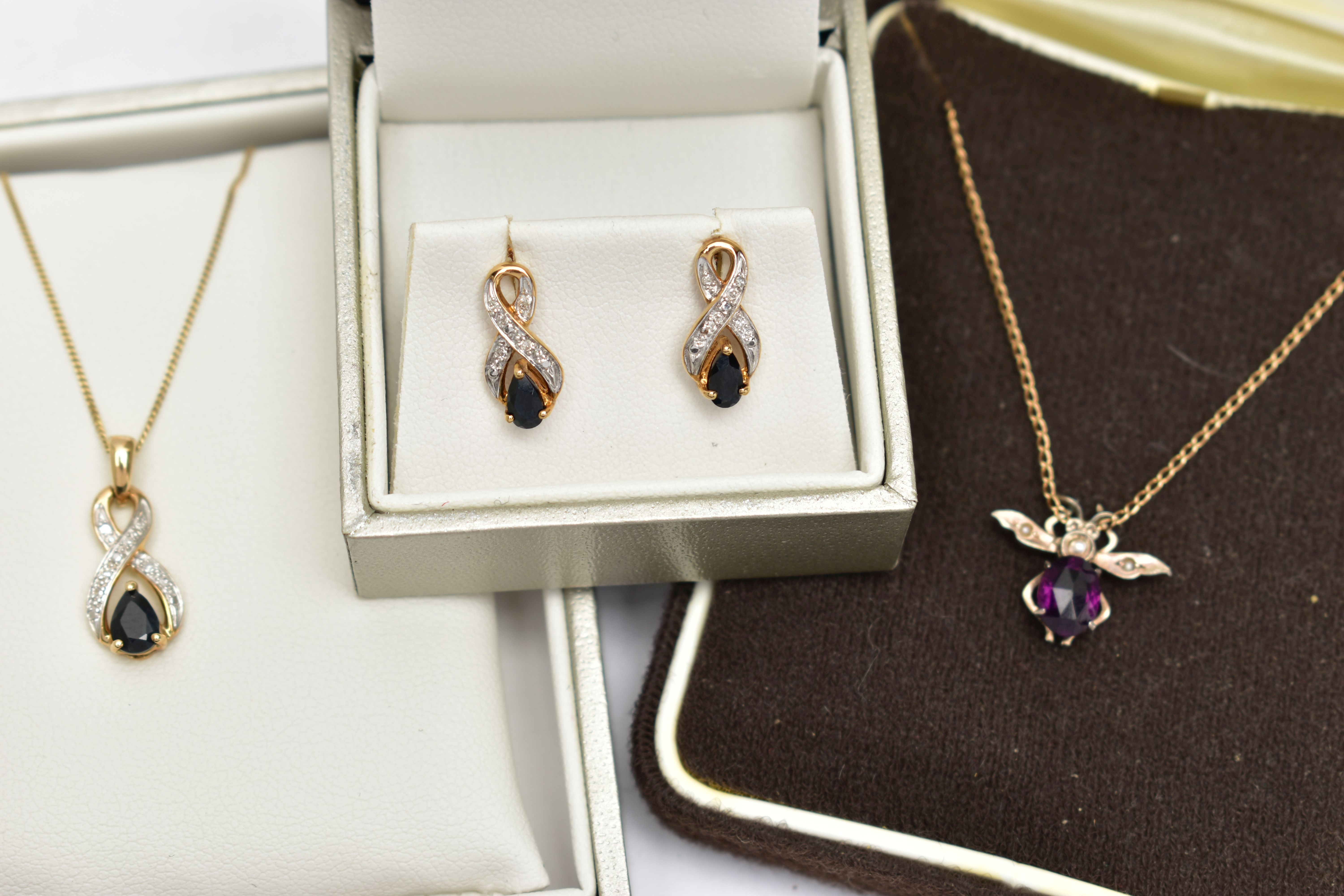A 9CT YELLOW GOLD SAPPHIRE AND DIAMOND NECKLACE AND EARRING SET, TOGETHER WITH A PASTE BUG PENDANT
