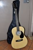 A CLASSICAL GUITAR IN A NYLON CARRY CASE, Martin Smith guitar W-101-N-PK (Natural), clip on tuner