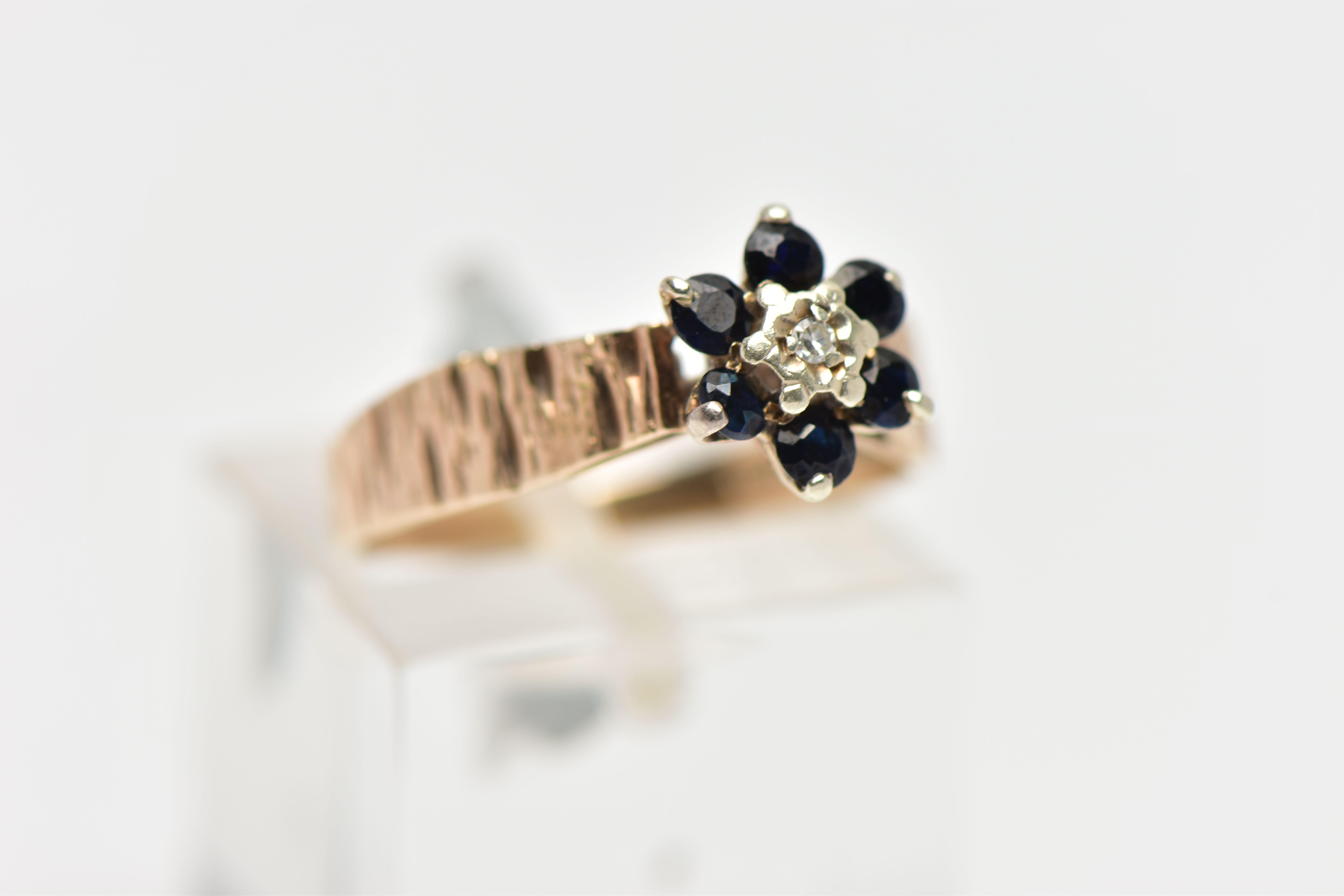 A 9CT GOLD SAPPHIRE AND DIAMOND CLUSTER RING, centring on an illusion set, single cut diamond, - Image 4 of 4