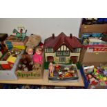 FIVE BOXES OF CHILDREN'S TOYS, GAMES, DOLLS AND A WOODEN DOLL'S HOUSE , to include a Triang 1950s