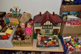 FIVE BOXES OF CHILDREN'S TOYS, GAMES, DOLLS AND A WOODEN DOLL'S HOUSE , to include a Triang 1950s