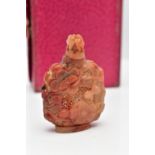A CARVED CARNELIAN PIERCED BOTTLE, of oriental design with various carved flowers and textured
