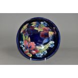 A MOORCROFT POTTERY ORCHID PATTERN LARGE FOOTED BOWL, with tube lined purple, pink and yellow