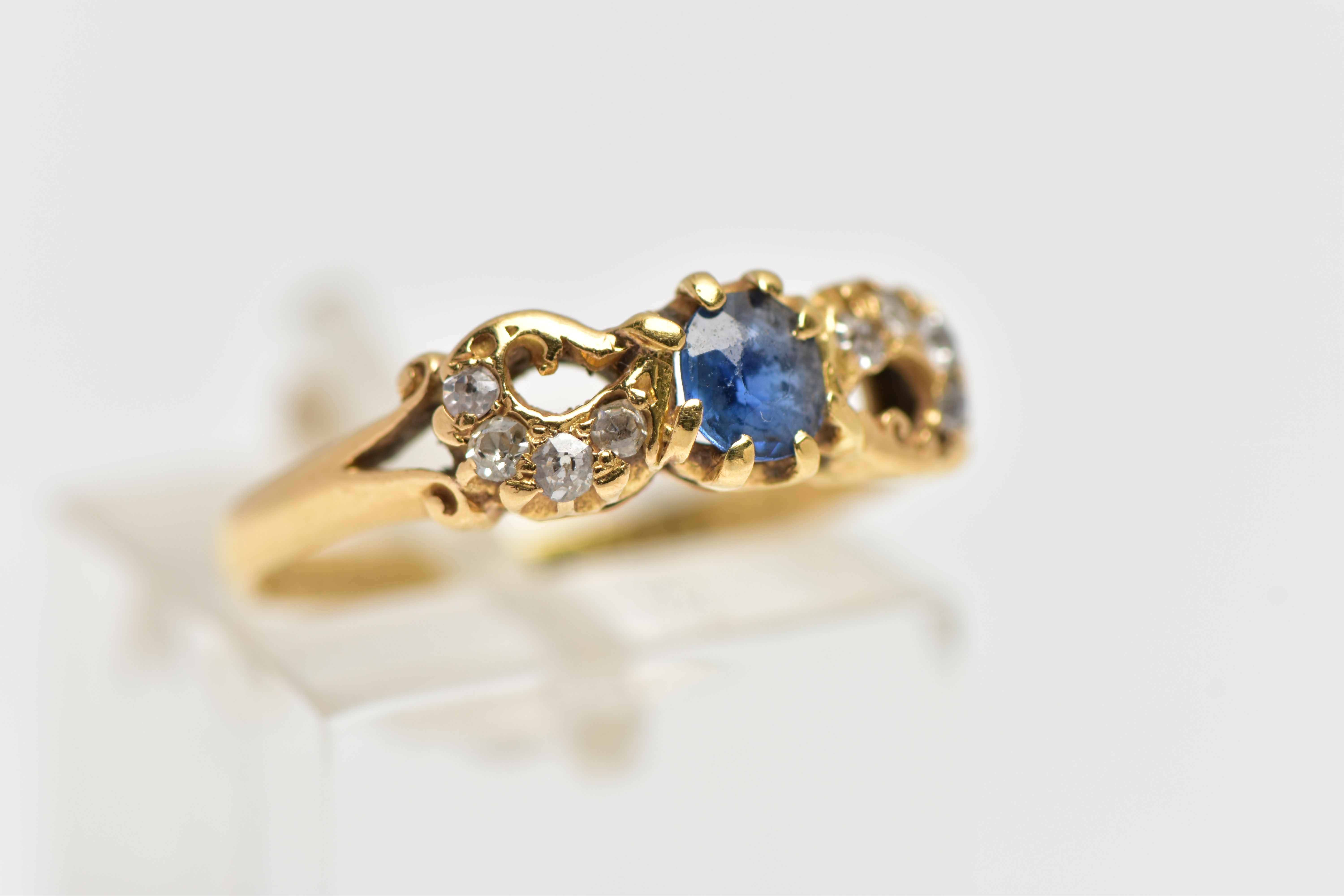 A LATE VICTORIAN 18CT GOLD SAPPHIRE AND DIAMOND DRESS RING, the oval cut sapphire claw set, with old - Image 4 of 4