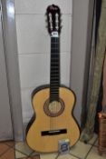 A CHARSLEY CHILDREN'S CLASSICAL GUITAR model number W360 together with a boxed EzetunE guitar