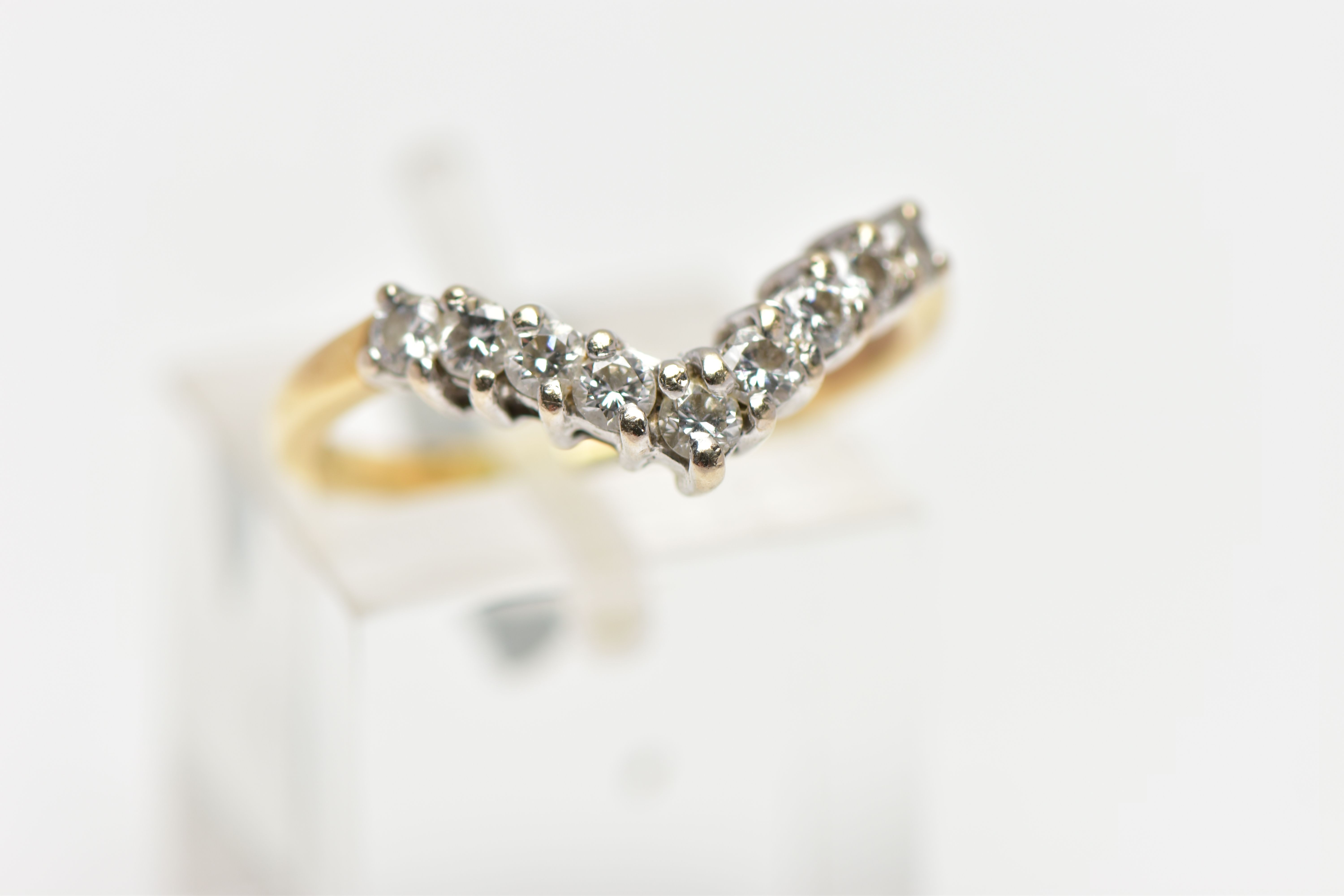 A 9CT GOLD DIAMOND NINE STONE WISH BONE RING, set with a series of nine uniform round brilliant - Image 4 of 4