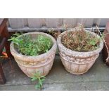 A PAIR OF COMPOSITE GARDEN PLANTERS with foliate panels to side diameter 40cm height 34cm
