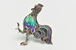 A WHITE METAL, PLIQUE A JOUR COCKEREL BROOCH, marcasite set body, with a circular cut ruby eye,