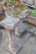 A COMPOSITE BIRD BATH width and depth of octagonal top 43cm, height 61cmand a Sun Dial height