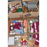 FOUR BOXES OF WOOL CARDING EQUIPMENT, BALLS OF WOOL AND KNITTING NEEDLES, to include a 1970's