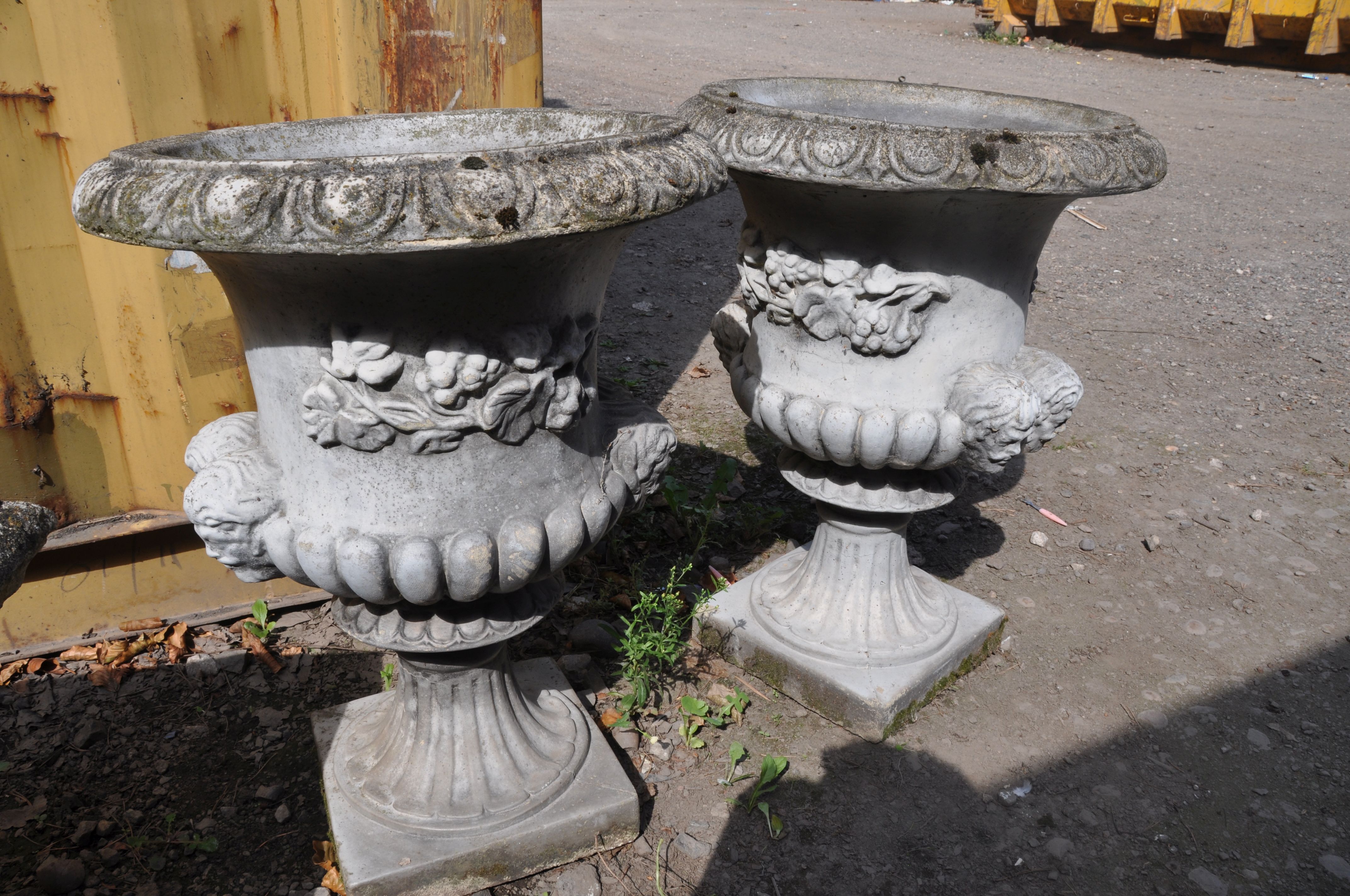 A PAIR OF MODERN COMPOSITE GARDEN URNS one piece in construction with dual mask motifs on opposing - Image 2 of 3