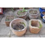 A PAIR OF COMPOSITE GARDEN PLANTERS with barrel effect detailing diameter 38cm height 39cm, and