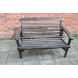 A MODERN PINE WOOD GARDEN BENCH with slatted seat and back width between arms 110cm (Condition:-