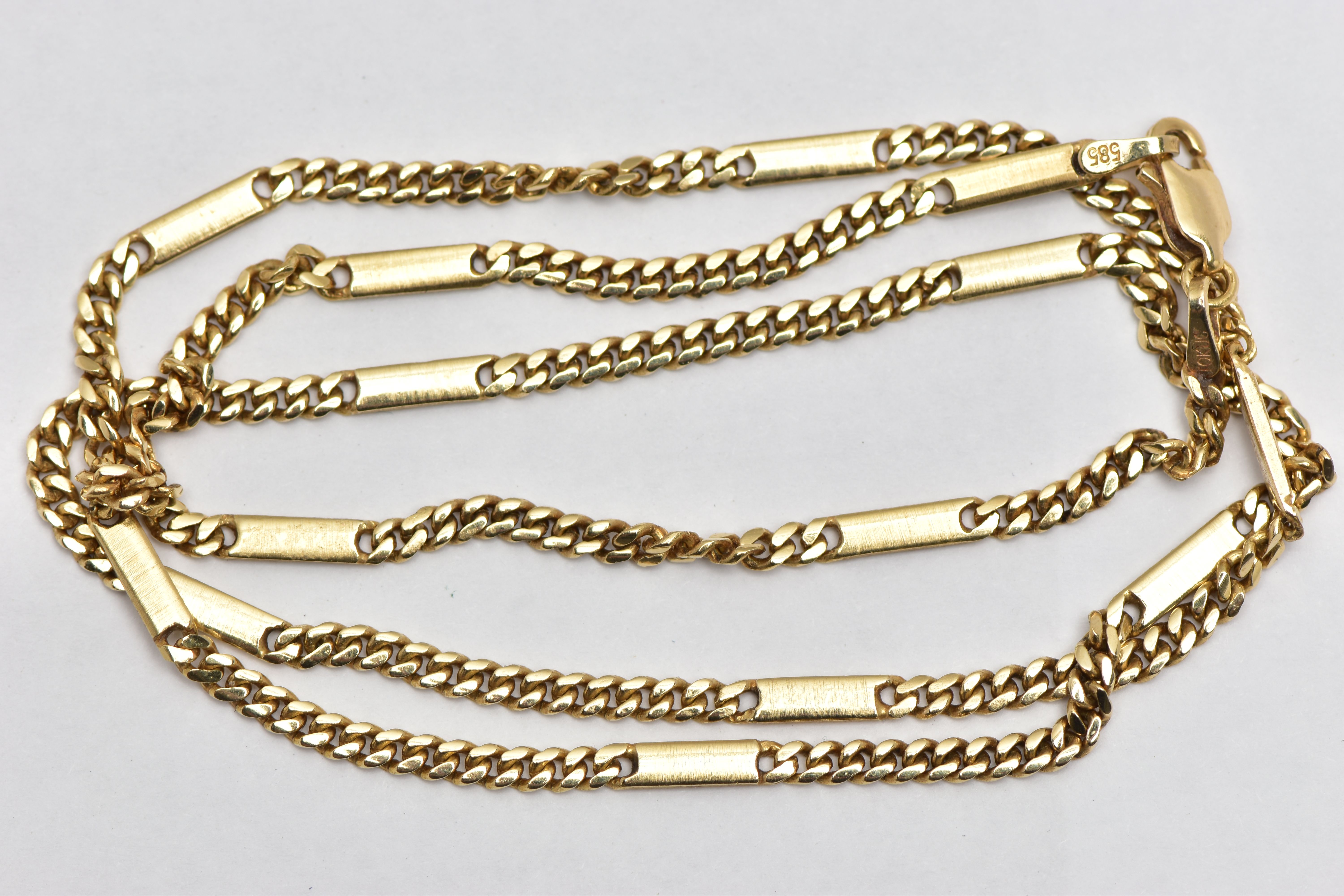 A YELLOW GOLD NECKLACE, designed as a fancy link chain, with plain polished links interspaced by