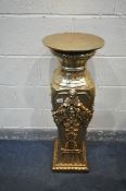 A GILT RESIN TORCHERE STAND, with fruiting vine detailing, and other foliate carving, 31cm