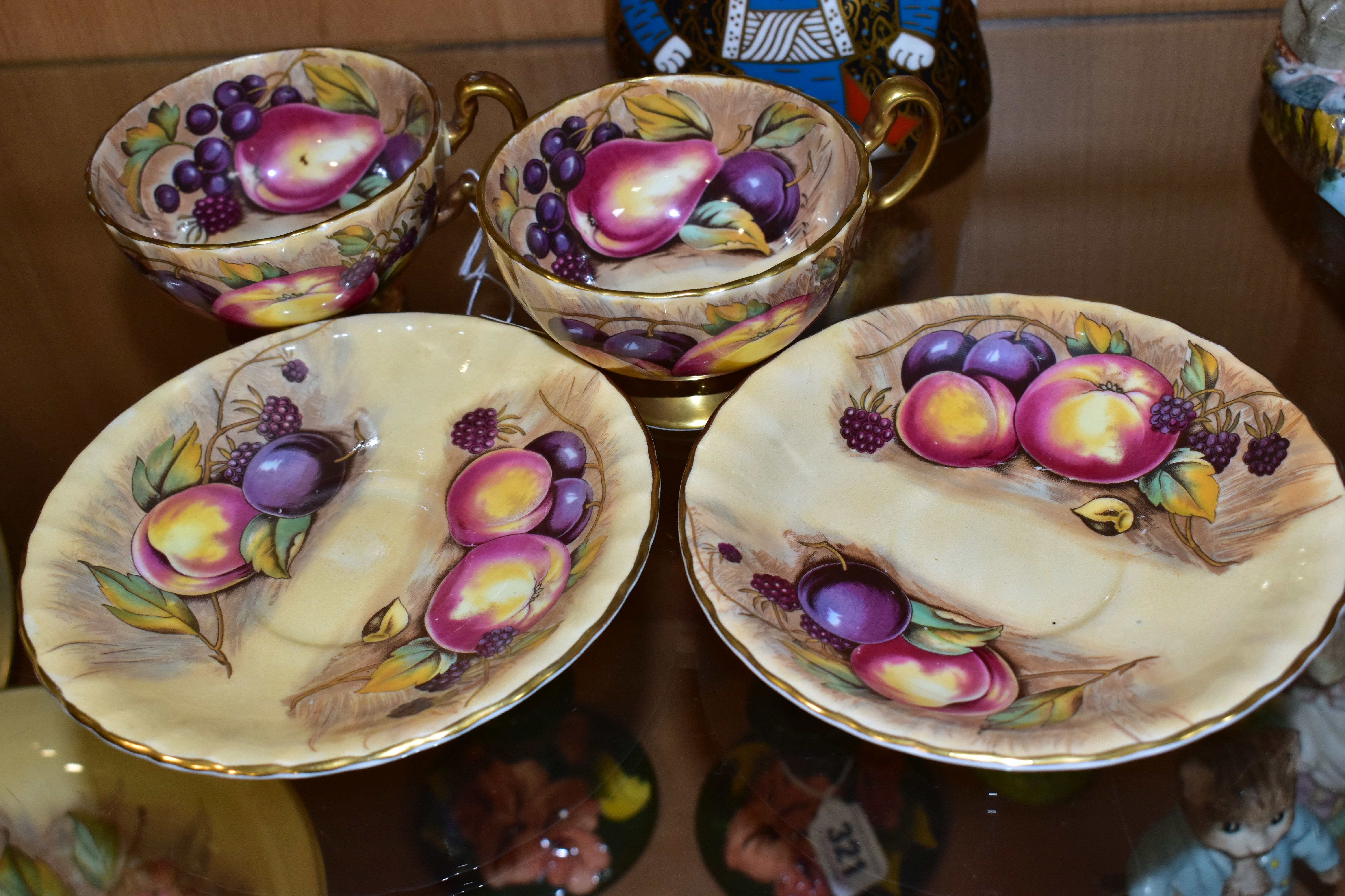 A PAIR OF AYNSLEY ORCHARD GOLD TEA CUPS AND SAUCERS, with gilt handles and rims, printed with - Image 3 of 4