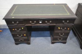 A MAHOGANY PEDESTAL DESK, with a green and tooled leather writing surface, and an arrangement of