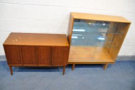 A TURNIDGE MID CENTURY TEAK BOOKCASE, with two glazed sliding doors, two glass shelves, and a