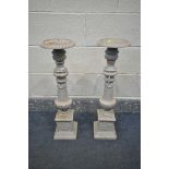 A PAIR OF CAST IRON CANDLE HOLDERS, height 70cm (condition:-later painted and slightly rusted)