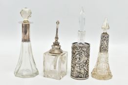 FOUR SILVER AND GLASS PERFUME BOTTLES, the first a square bottle fitted with a silver lid,