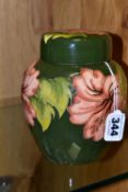 A MOORCROFT POTTERY CORAL HIBISCUS COVERED GINGER JAR, the green ground decorated with coral