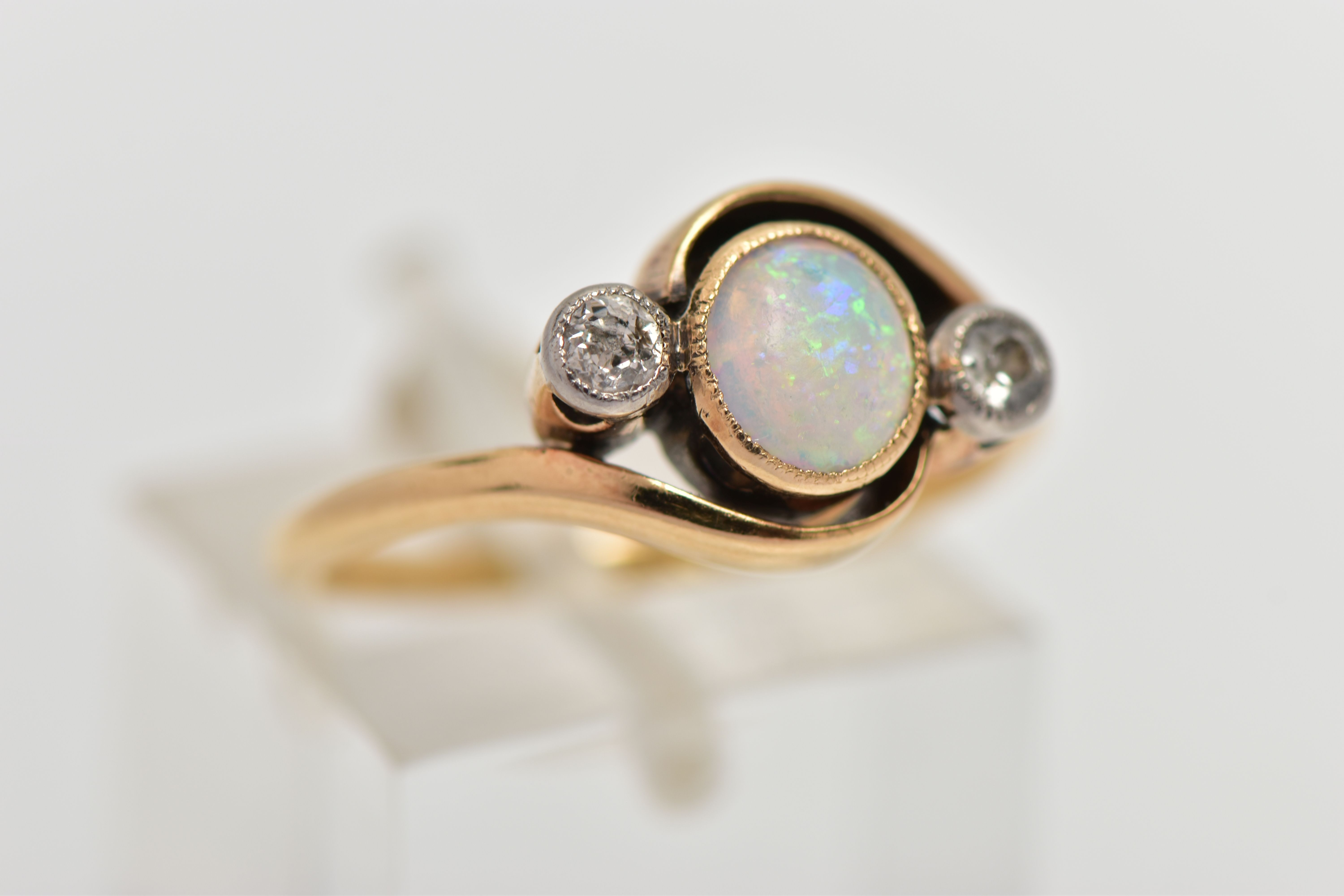 A YELLOW METAL OPAL AND DIAMOND DRESS RING, the central opal cabochon, collet set, with old cut - Image 4 of 4