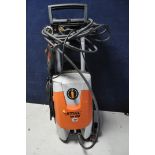 A STIHL RE108 PRESSURE WASHER with hose and lance (PAT pass and powers up)