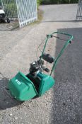 A SUFFOLK PUNCH 14S CYLINDER PETROL LAWNMOWER, with grass box (engine turns)
