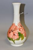 A MOORCROFT POTTERY CORAL HIBISCUS BOTTLE VASE, the cream ground decorated with coral hibiscus