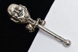 A MID 19TH CENTURY WHITE METAL BABY RATTLE, depicting a character to the top, suspending three