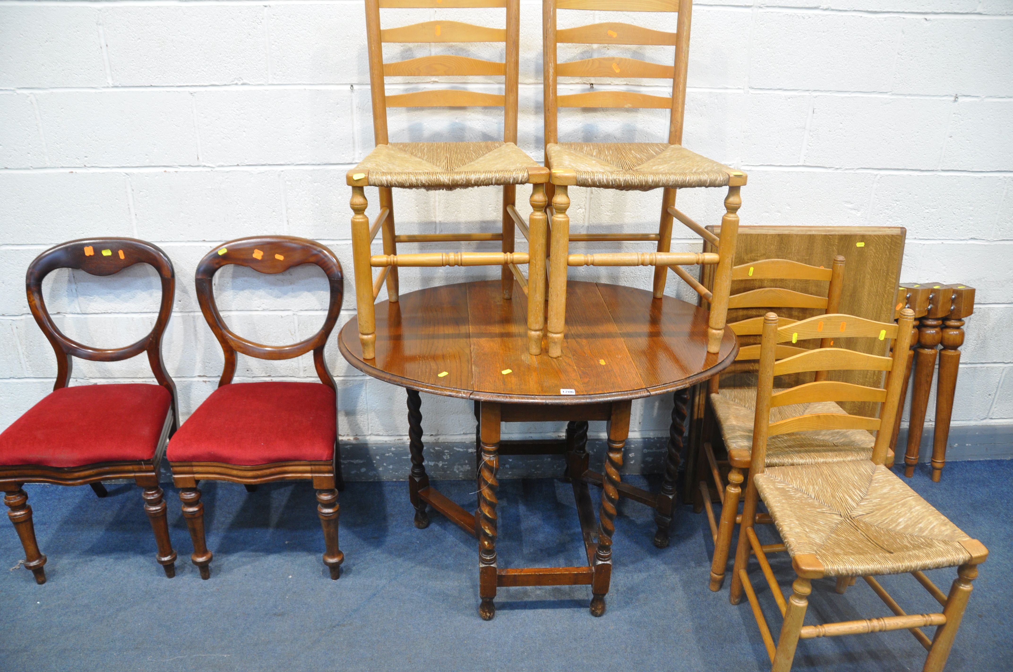 A DISMANTLED OAK TABLE (missing nuts for the legs) a 20th century oak gate leg table, with barley