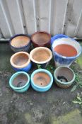 A SELECTION OF GLAZED PLANTERS, of various sizes and colours, largest pot diameter 34cm x height