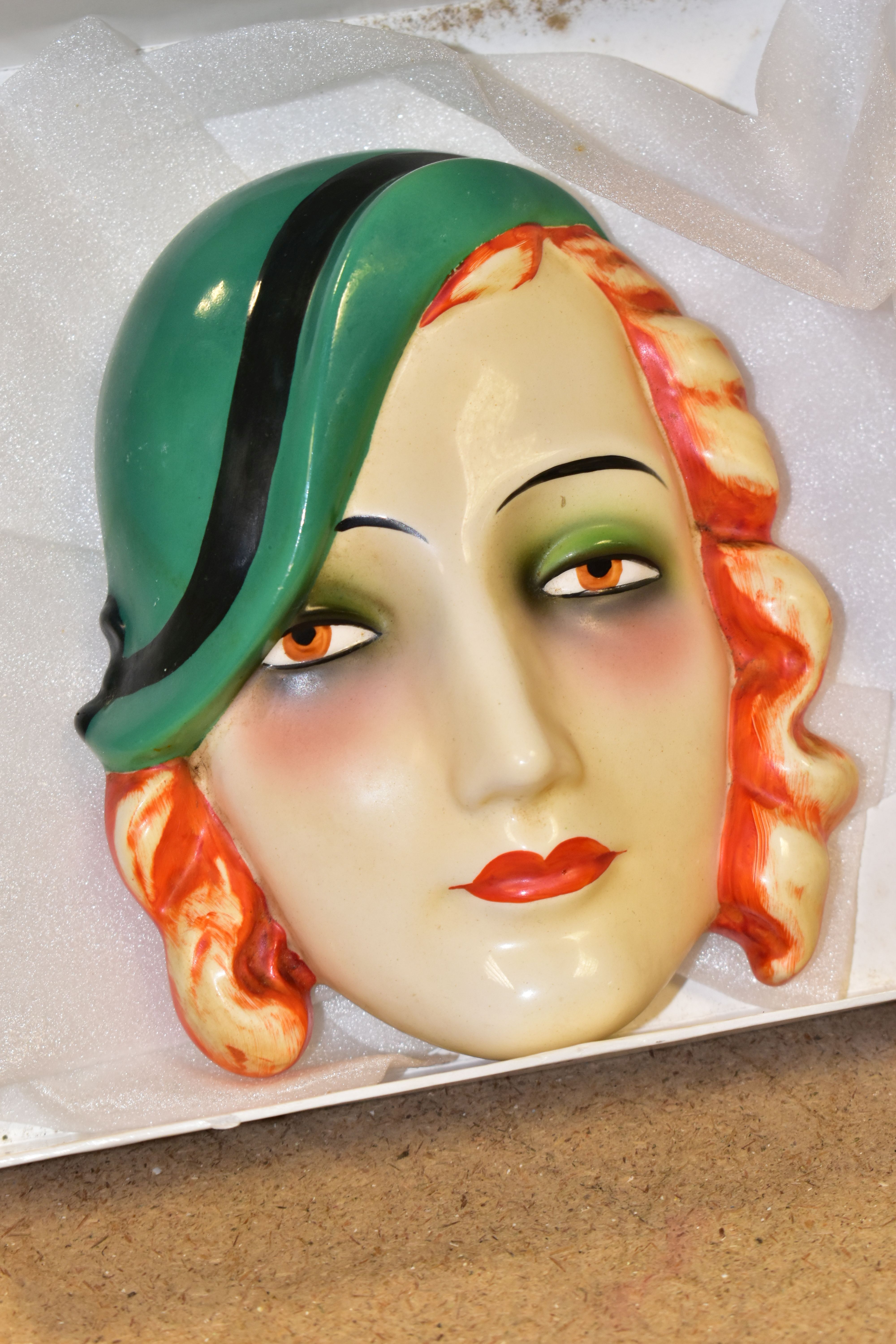 AN ART DECO GOEBEL FACE MASK, of a red haired lady wearing a green hat, impressed backstamp verso, - Image 2 of 4