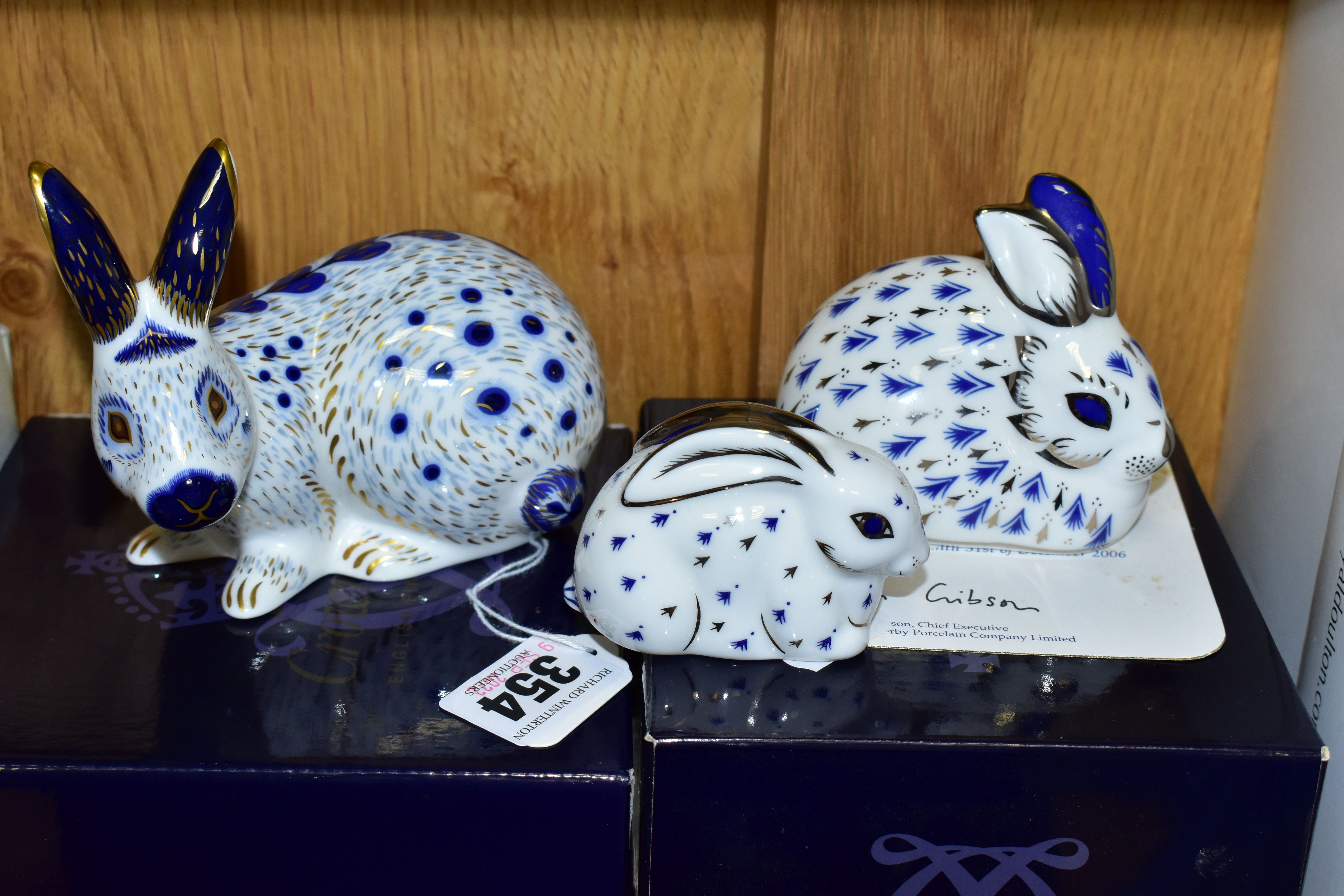 THREE BOXED ROYAL CROWN DERBY PAPERWEIGHTS, comprising English Rabbit, Blue, and 25th Anniversary