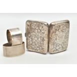 A SILVER CIGARETTE CASE AND TWO NAPKIN RINGS, a rectangular form case, foliage engraving detail,