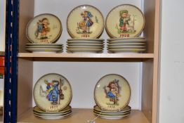 TWENTY FOUR BOXED HUMMEL PLATES, relief moulded with a different character, years 1972-1995