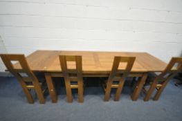 A SOLID OAK DRAW LEAF DINING TABLE, on block legs, extended length 280cm x closed length 180cm x