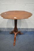 A VICTORIAN WALNUT TILT TOP SIDE TABLE, with shaped top on an unusual upright, and tripod legs,
