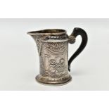 AN EARLY 20TH CENTURY SILVER MILK JUG, of continental design, depicting mythical creatures/
