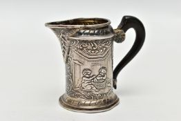 AN EARLY 20TH CENTURY SILVER MILK JUG, of continental design, depicting mythical creatures/