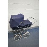 A VINTAGE FOLDING NAVY BLUE SILVER CROSS PRAM (condition - finish peeling)