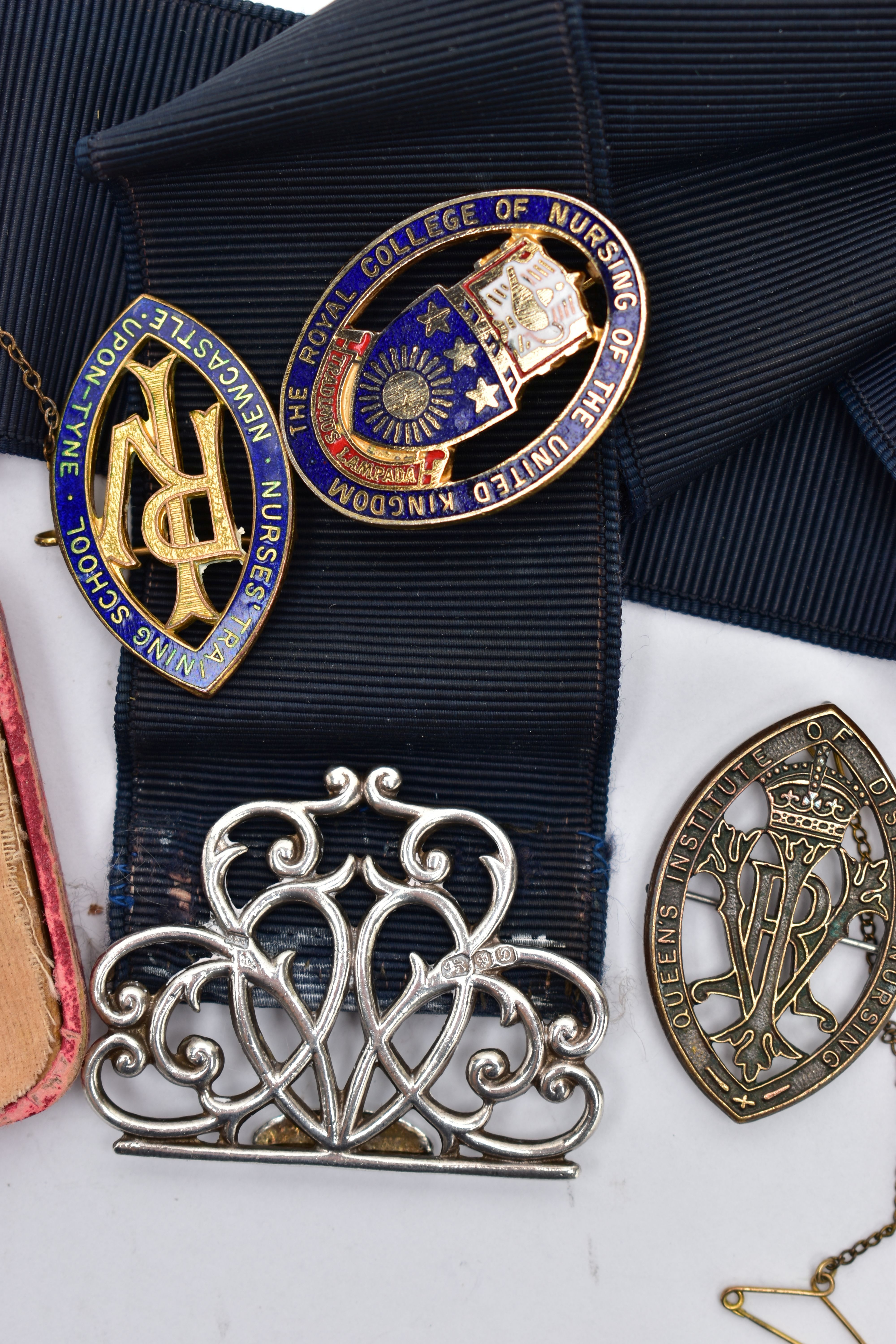 A SILVER NURSES BELT BUCKLE AND NURSING BADGES, a silver open work belt buckle fitted to a stretch - Image 3 of 3